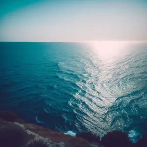 Serene Beach Sunset over the Turquoise Sea