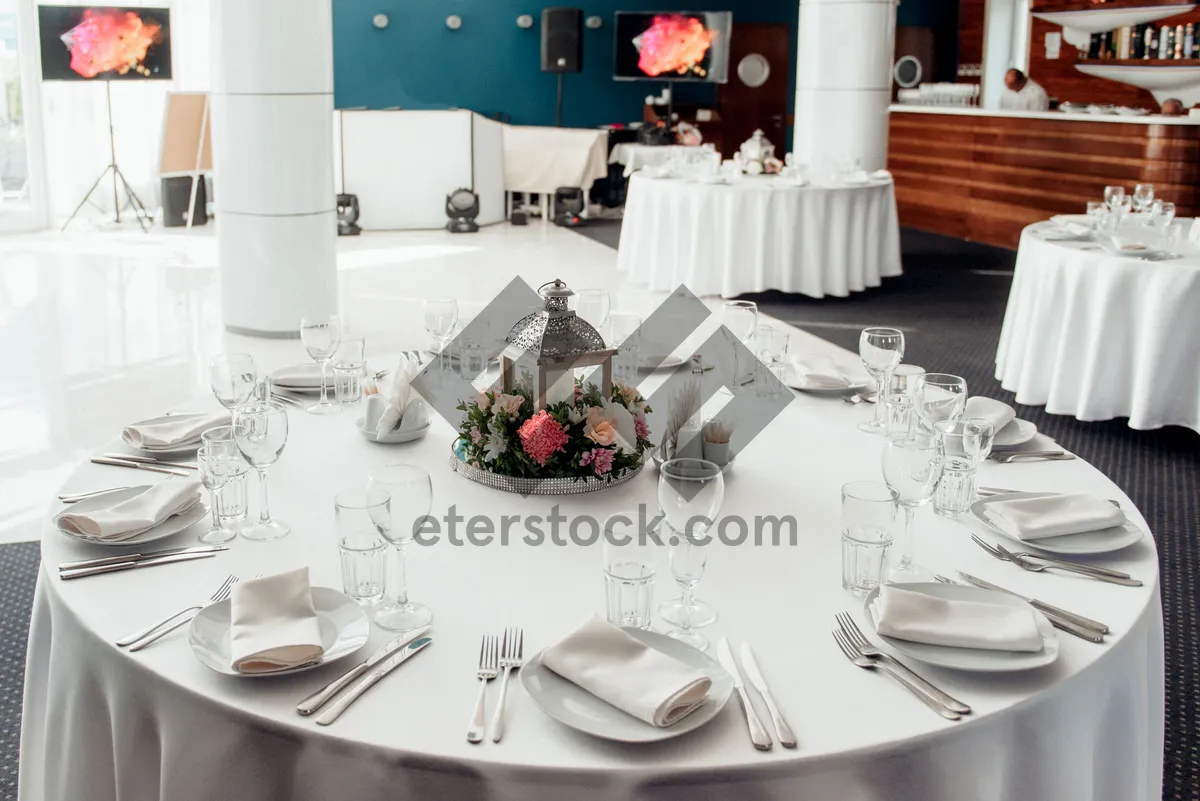 Picture of Elegant dinner party table setting with wine glasses