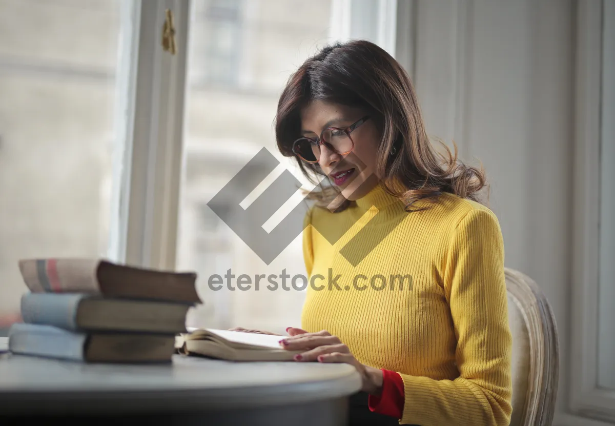 Picture of Smiling businesswoman with laptop in cheerful kitchen setting