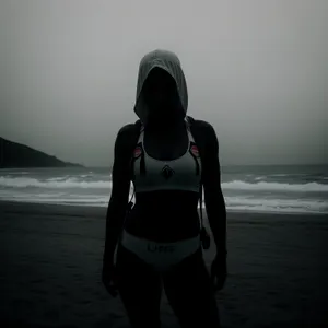 Sunset Beach Silhouette of Man in Wet Suit