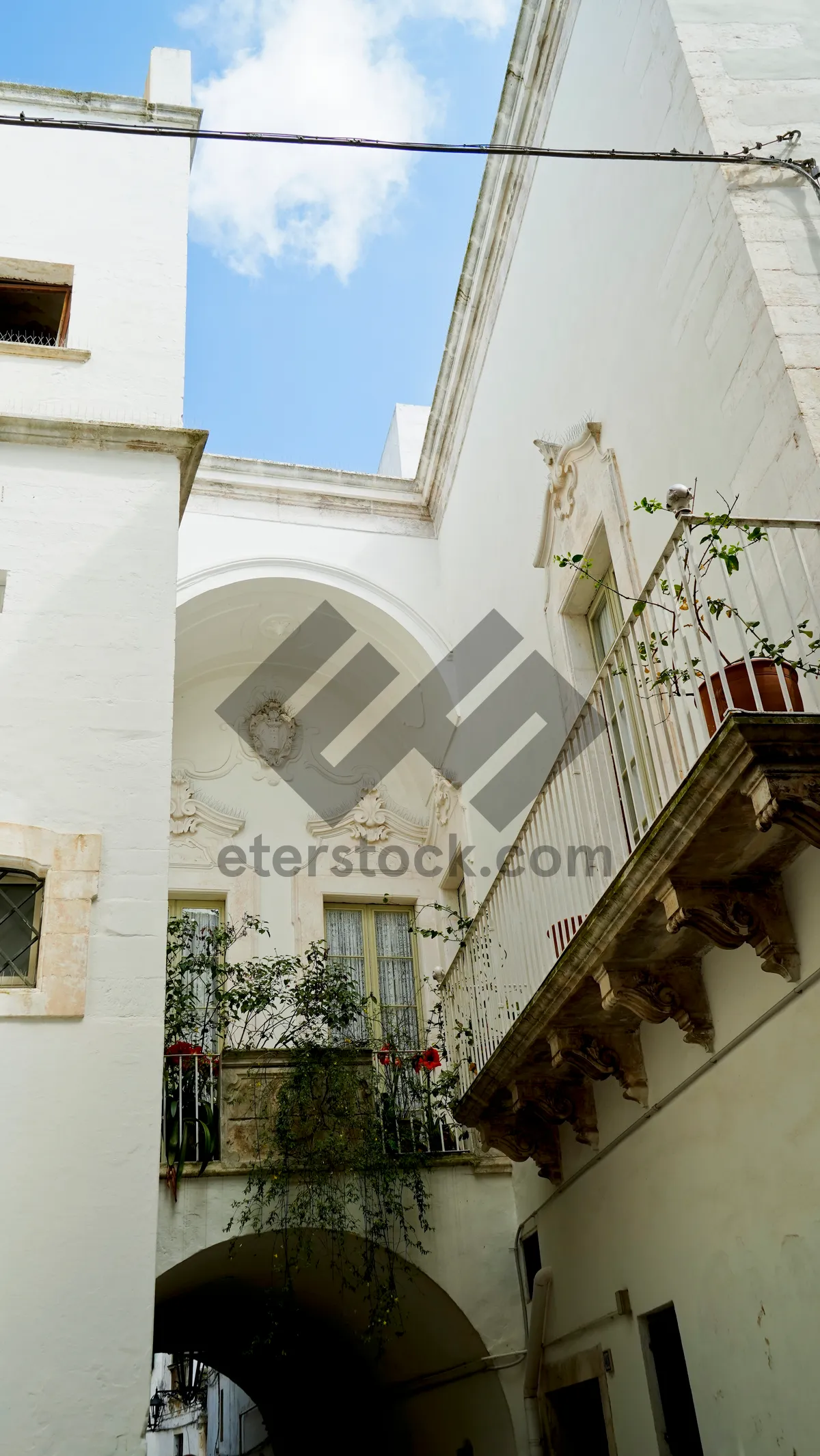 Picture of Historic cathedral in old city with balcony and tower.