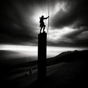 Sunset Pole Silhouette against Dusky Sky