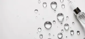 Fresh water droplets on glass surface.