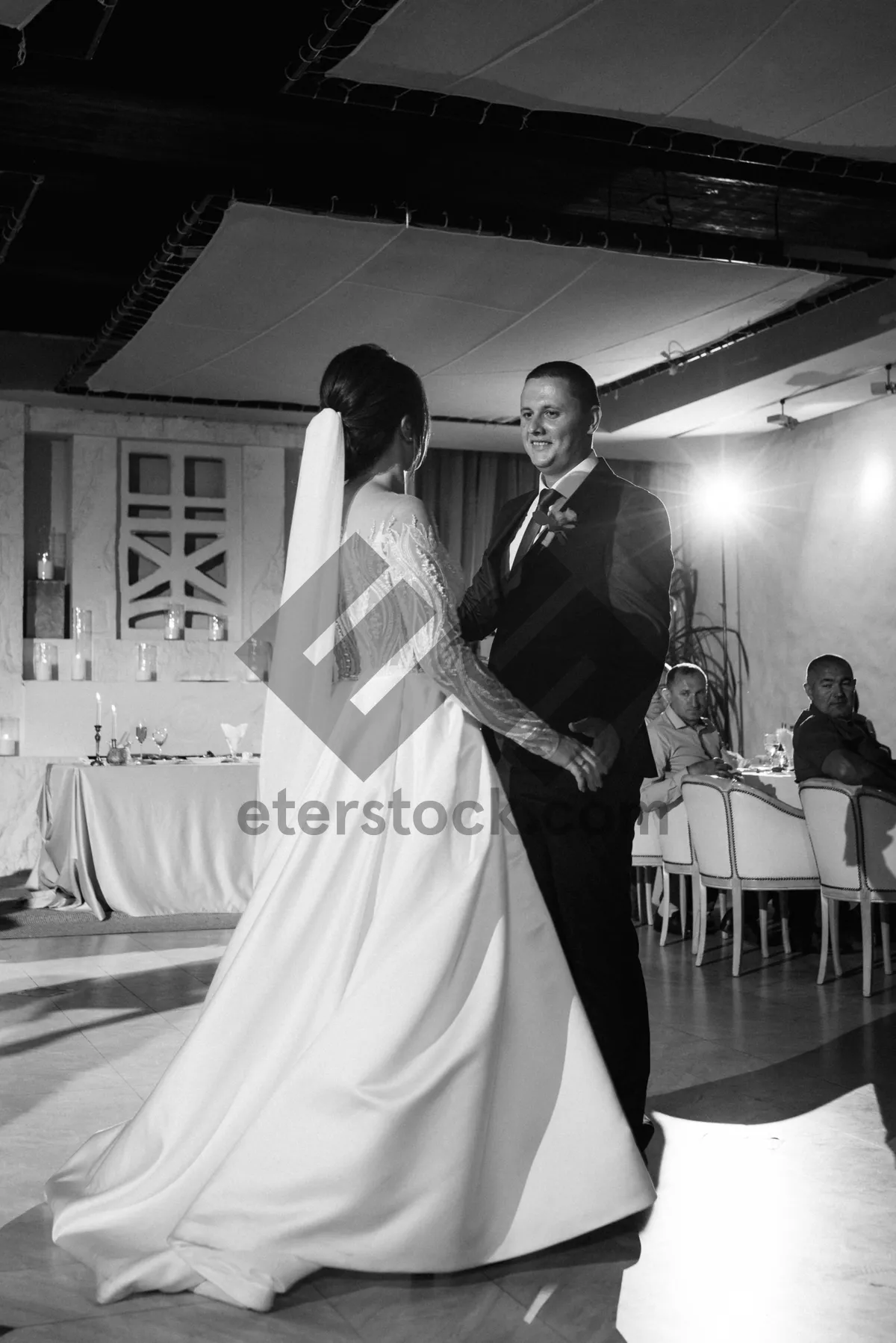 Picture of Happy Wedding Couple in Bridal Boutique shopping for dress