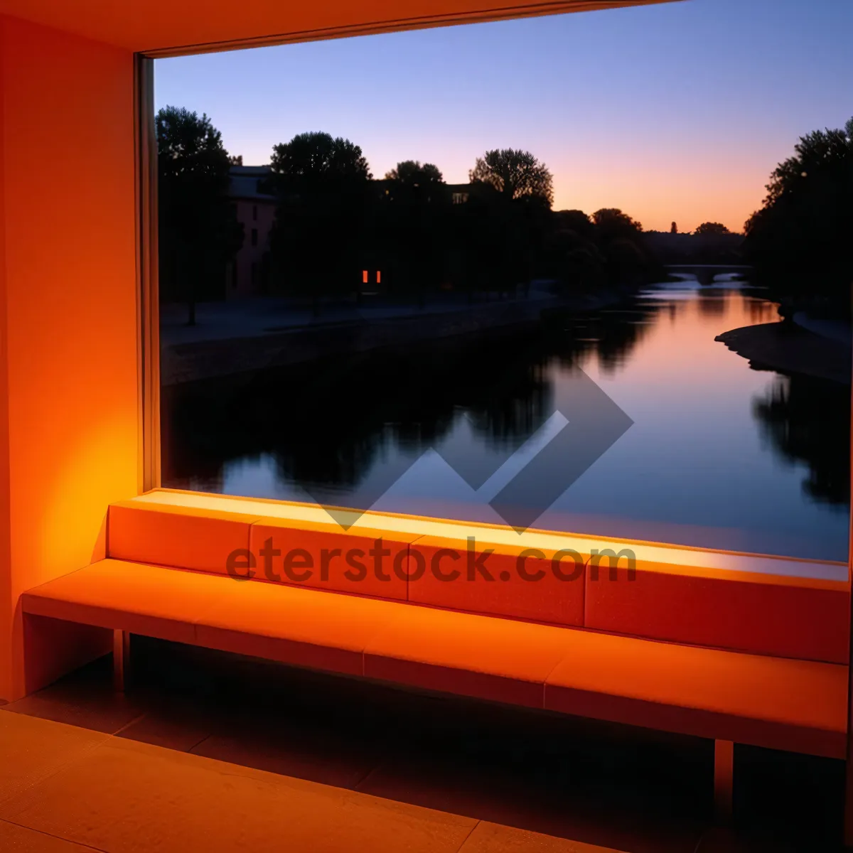 Picture of Silhouette of tree against colorful sunset sky reflection