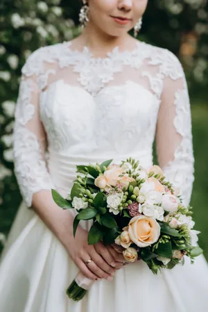 Happy Wedding Couple in Floral Bouquet