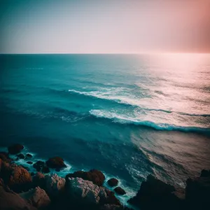 Serenity at Sunset: Coastal Waters Embrace the Horizon