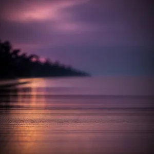 Vibrant Sunset Reflection over Tranquil Ocean Beach