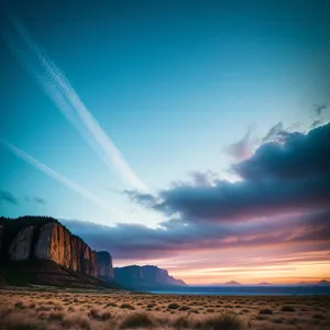 Golden Horizon: A Serene Sunset over Vast Desert Landscape