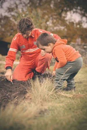 Happy father and son smiling in the park