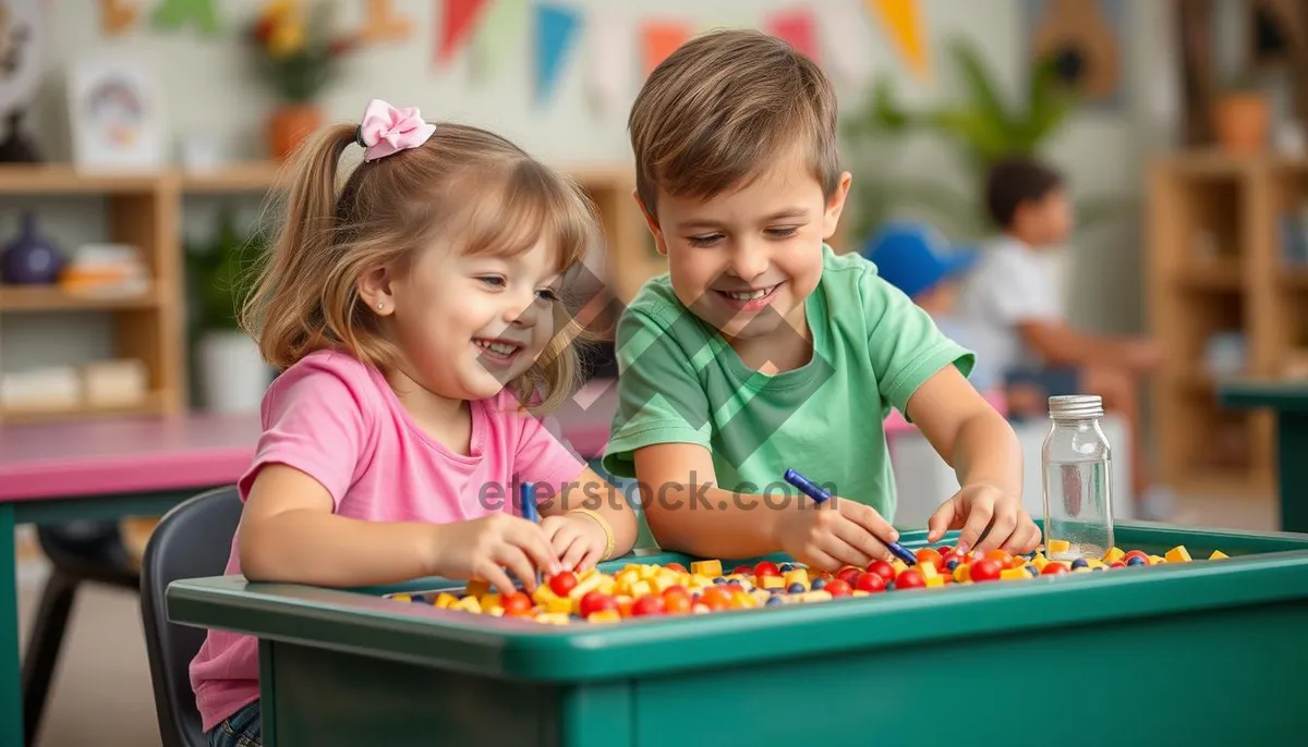 Picture of Smiling young boy learning at home with family