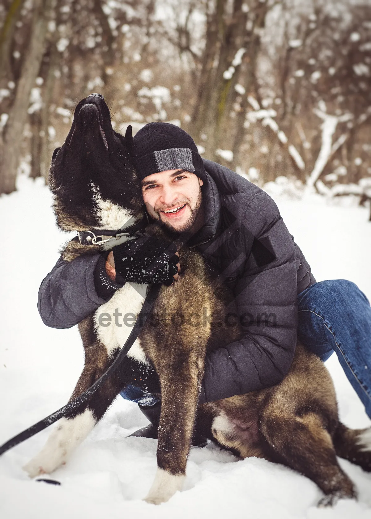 Picture of Happy man smiling outdoors in snowy weather.