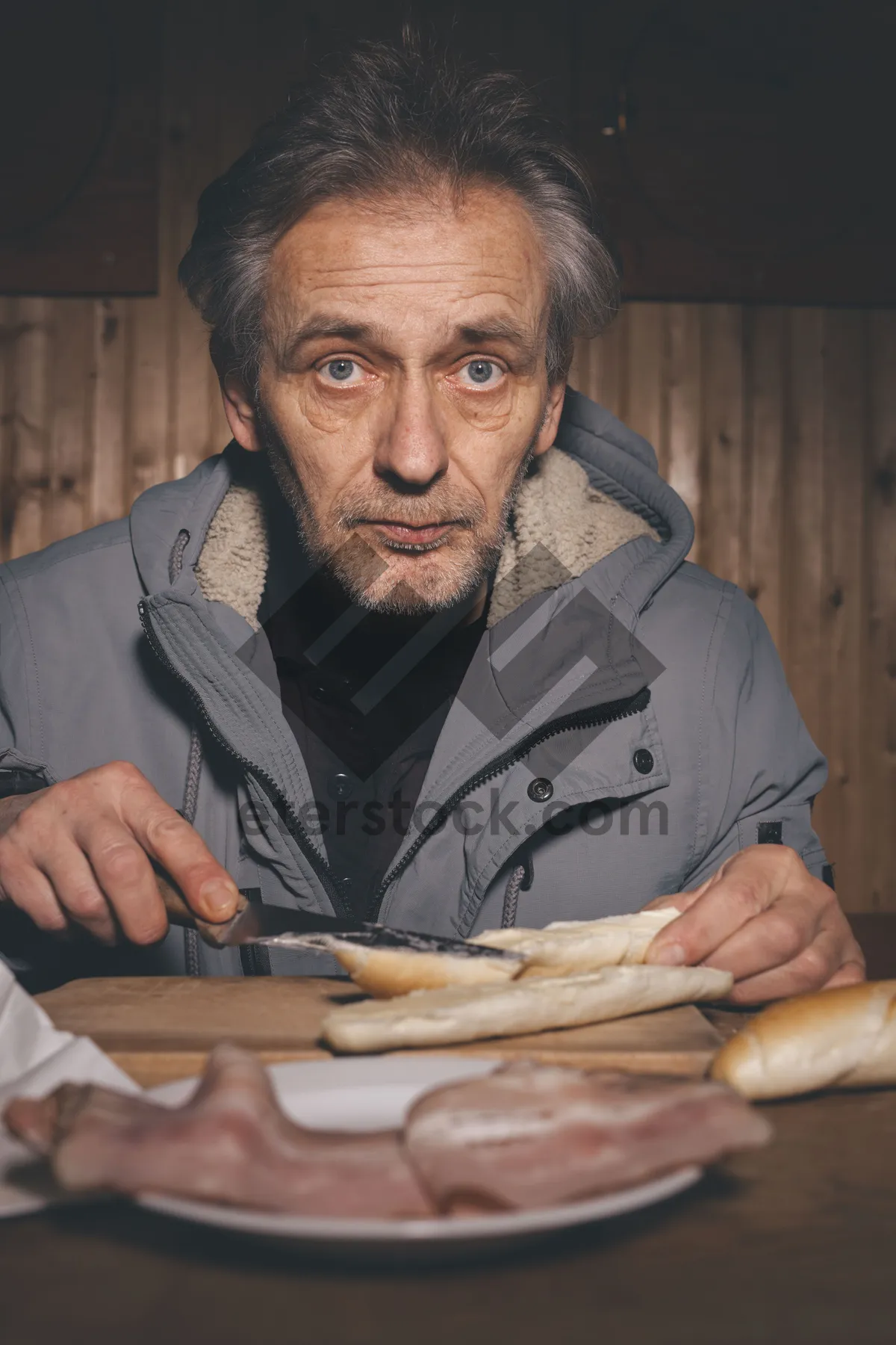 Picture of Happy elderly man sitting at home with glasses