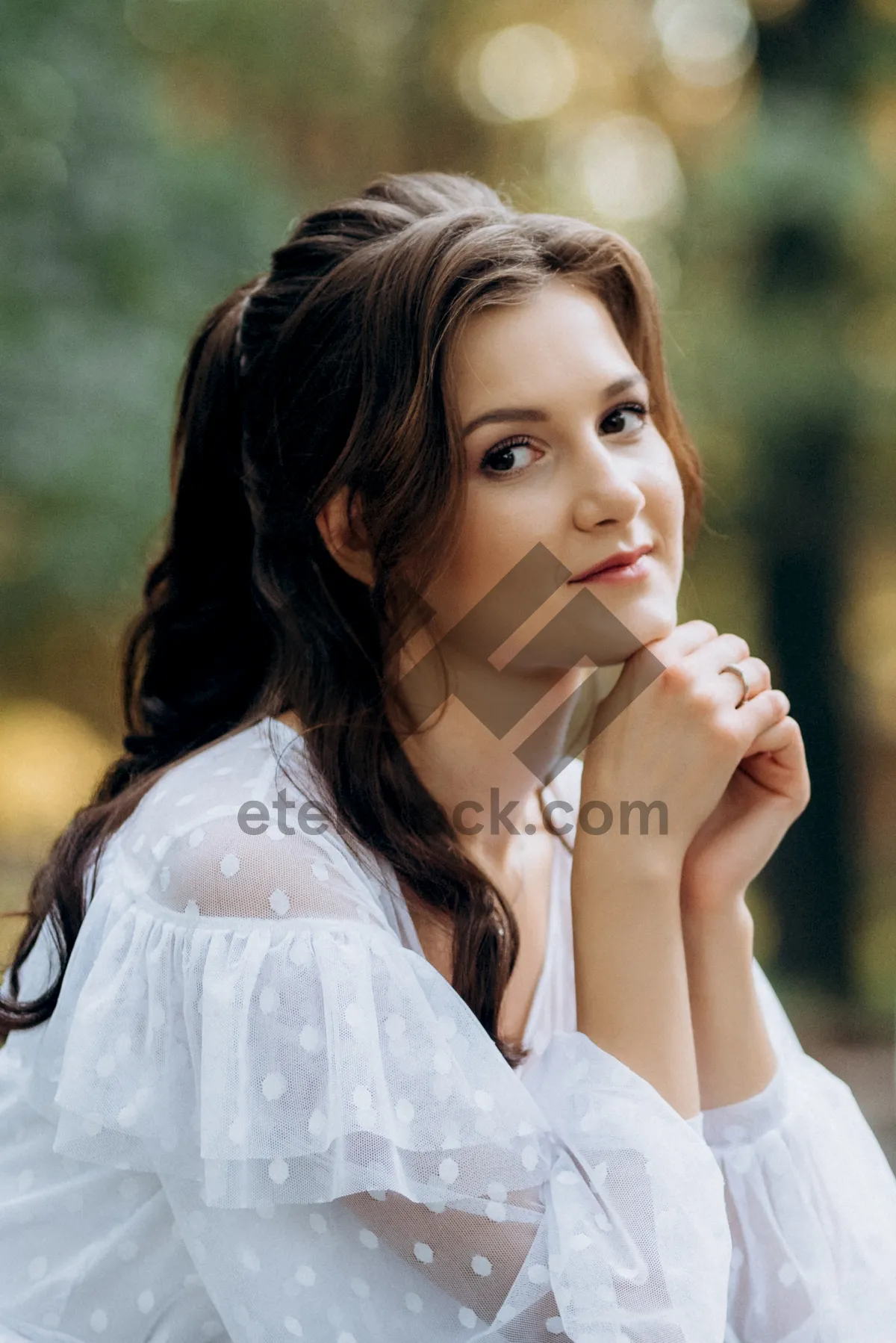 Picture of Smiling brunette lady in the park during summer