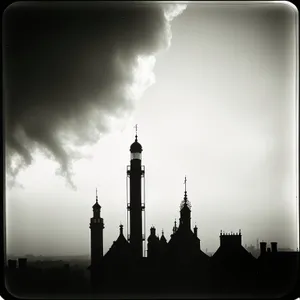 Sunset silhouette of magnificent mosque with towering minarets.