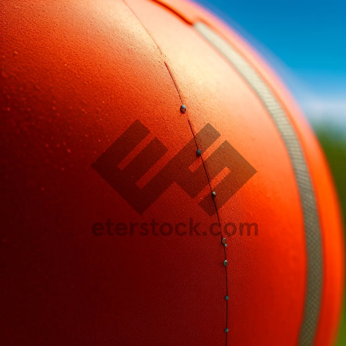Picture of Sunlit Orange Sphere Balloon in Sports Competition