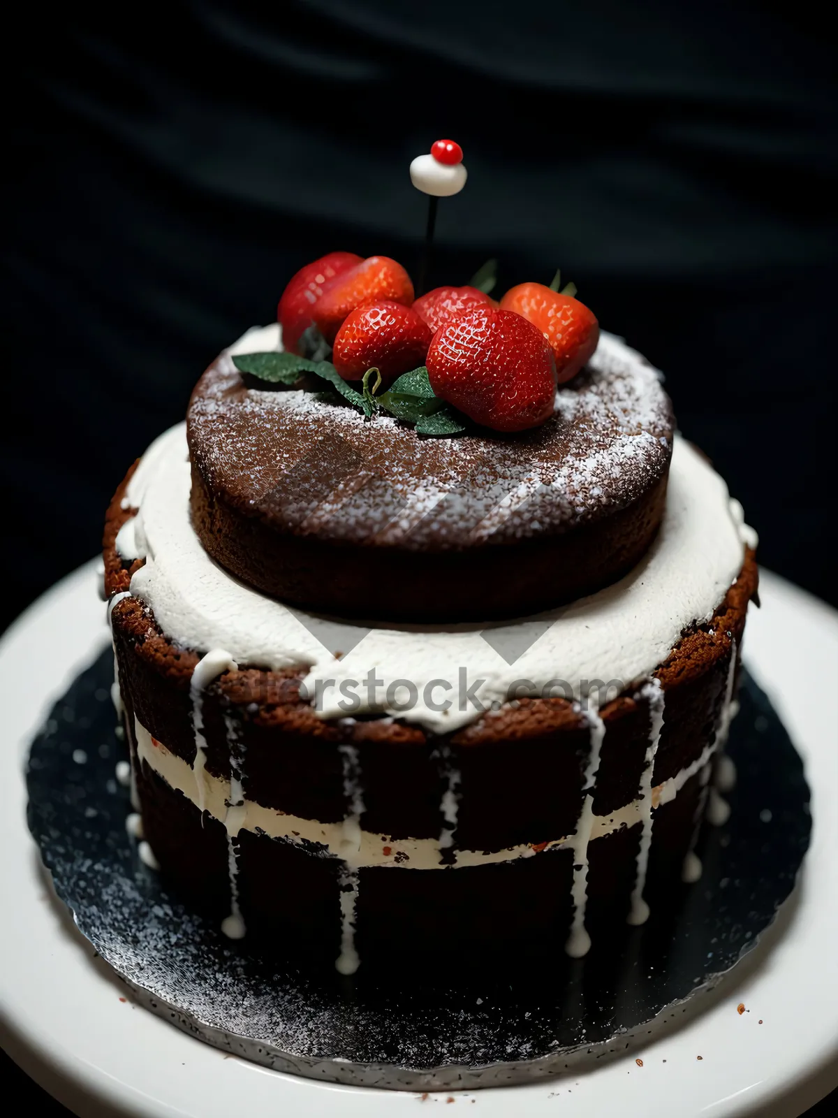 Picture of Delicious Strawberry Cake with Chocolate Sauce and Fresh Berries