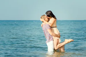 Happy beach vacation in beautiful swimsuit