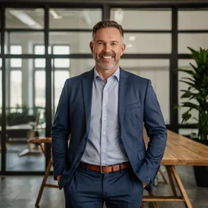 Smiling male executive in modern office building