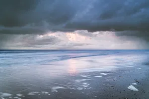 Tranquil sunset over tropical beach coastline