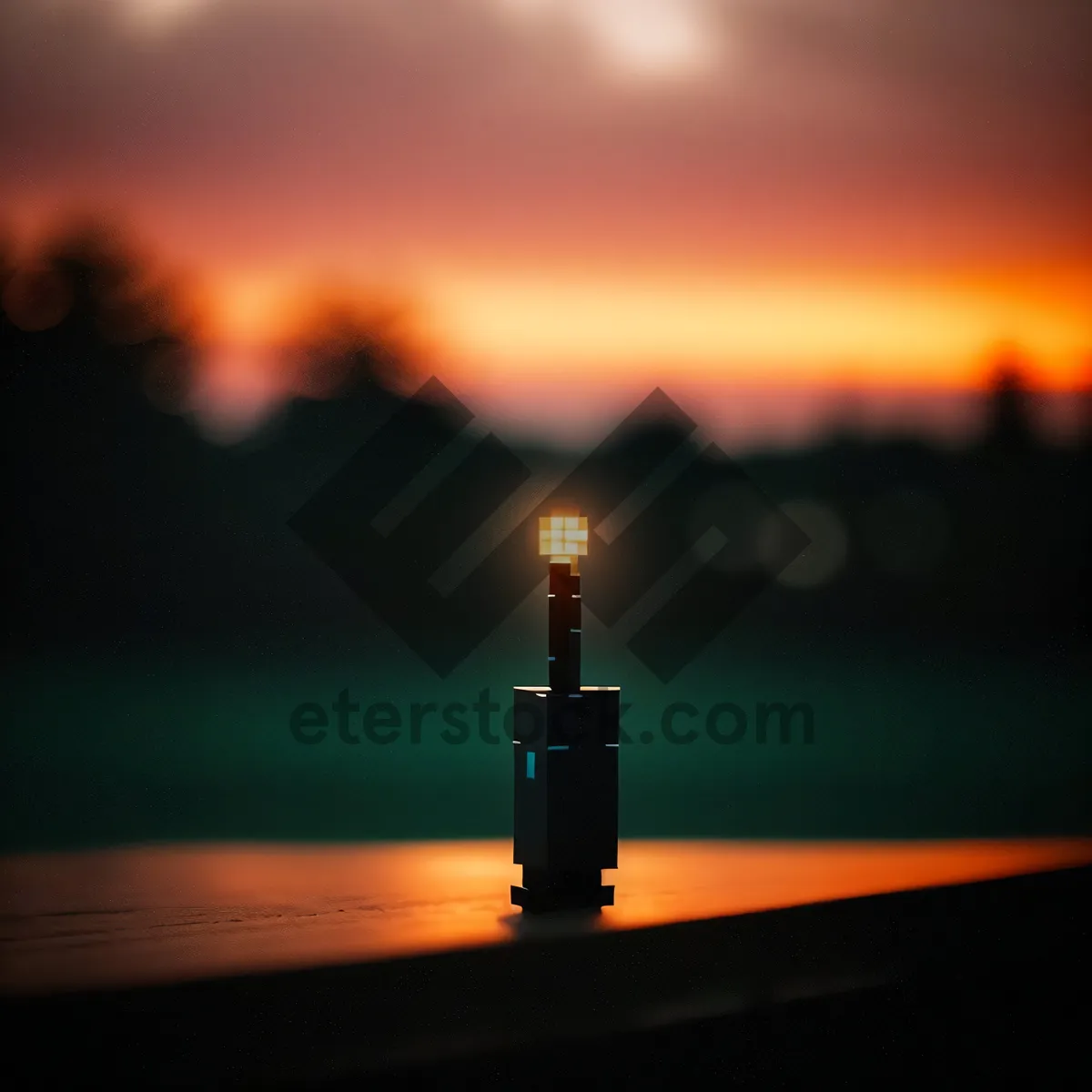 Picture of Sunset Beacon Tower Silhouetted in Orange Sky