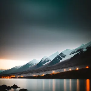 Serenity Over Sunlit Mountain Range Reflection on Lake