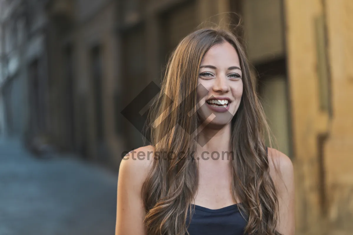 Picture of Attractive brunette model smiling for fashion shoot.