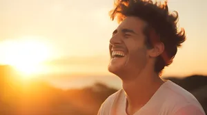 A beautiful young man laughing happily. Mouth detail, dental health or dental clinic concept.