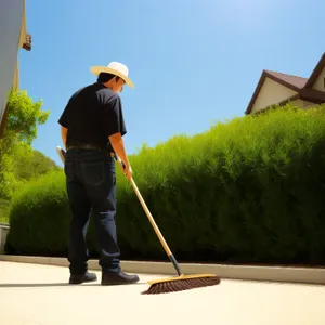 Active Golfer Cleaning Golf Ball on the Course