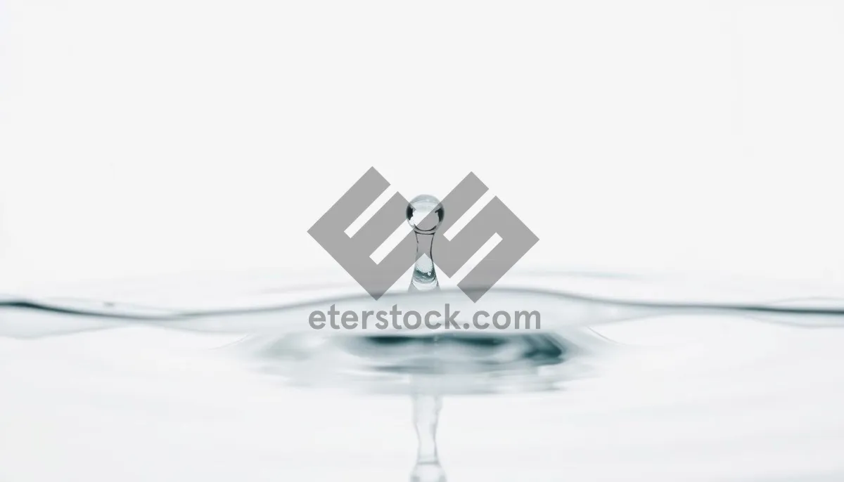 Picture of Crystal clear wineglass with splashing water faucet