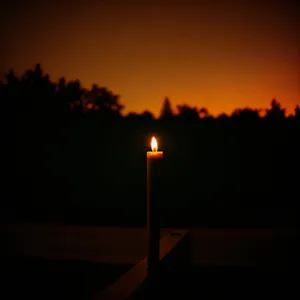Twilight Glow: Silhouetted Torch against Darkening Sky
