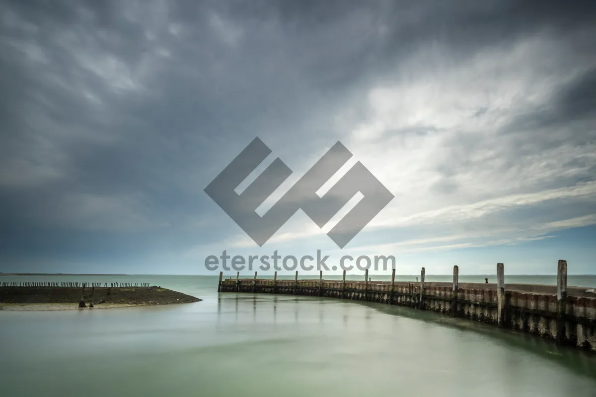 Picture of Bridge over serene waters on a sunny day