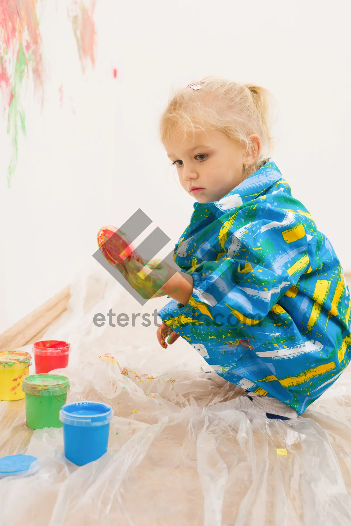 Picture of Happy Toddler Playing with Toy Ice Lolly