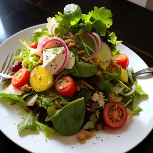Gourmet plate with fresh organic vegetables and cheese.