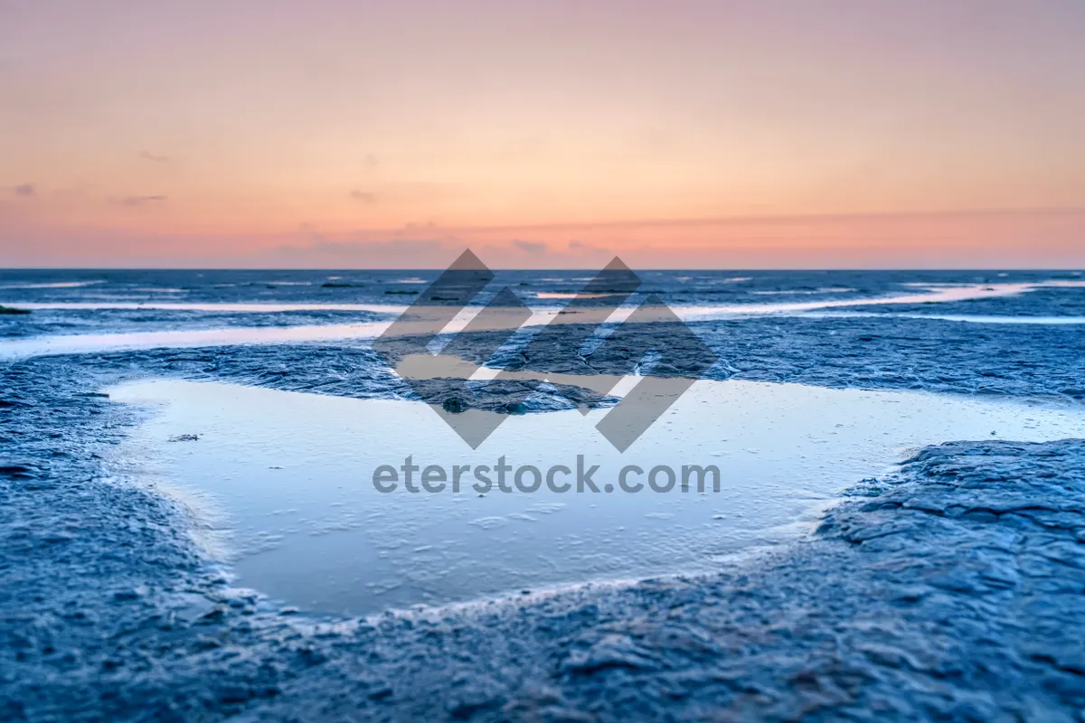 Picture of Tropical Sunset Paradise Beach Reflection vacation landscape.