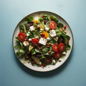 Healthy vegetable salad with fresh tomatoes and cheese.