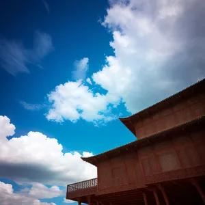 Serene Summer Sky Over a Farm Building