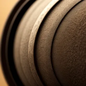 Music Equipment Close-Up: Basketball Speaker with Black Lens