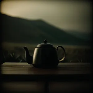Brown Ceramic Teapot: Traditional Kitchen Vessel for Hot Beverages