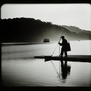 Silhouette Fisherman Enjoying Sunset on Boat