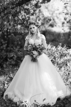 Happy bride and groom celebrating outdoors with flowers