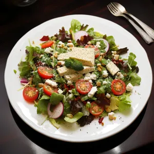 Healthy gourmet vegetable salad with fresh tomatoes and cheese
