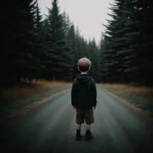 Pedestrian walking on road in park