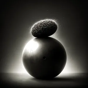 Light bulb illuminating black sphere with microphone