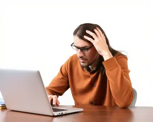 Confident businesswoman working on laptop in office.