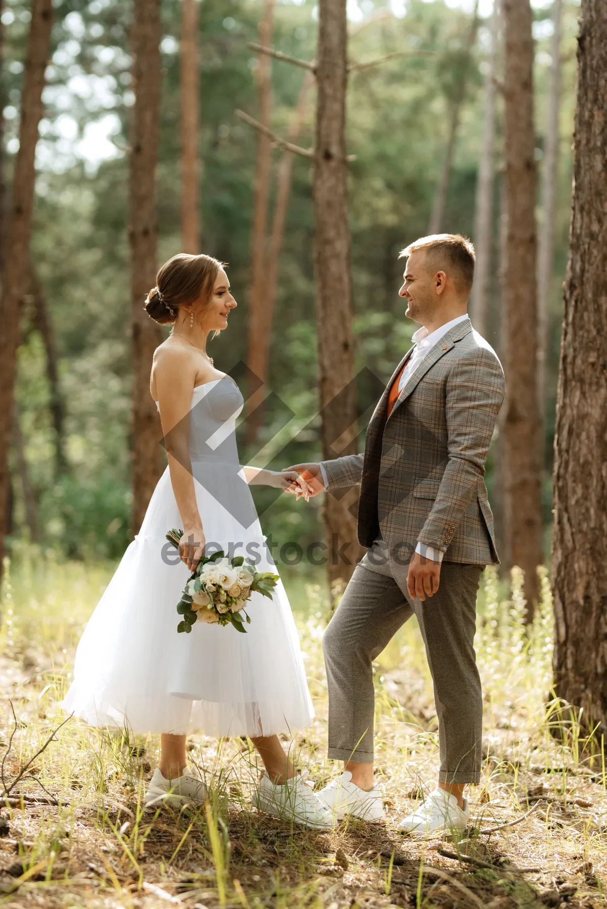 Picture of Happy wedding couple enjoying outdoor celebration in the summer