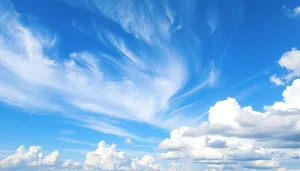 Bright Summer Sky with Fluffy Clouds and Sunshine