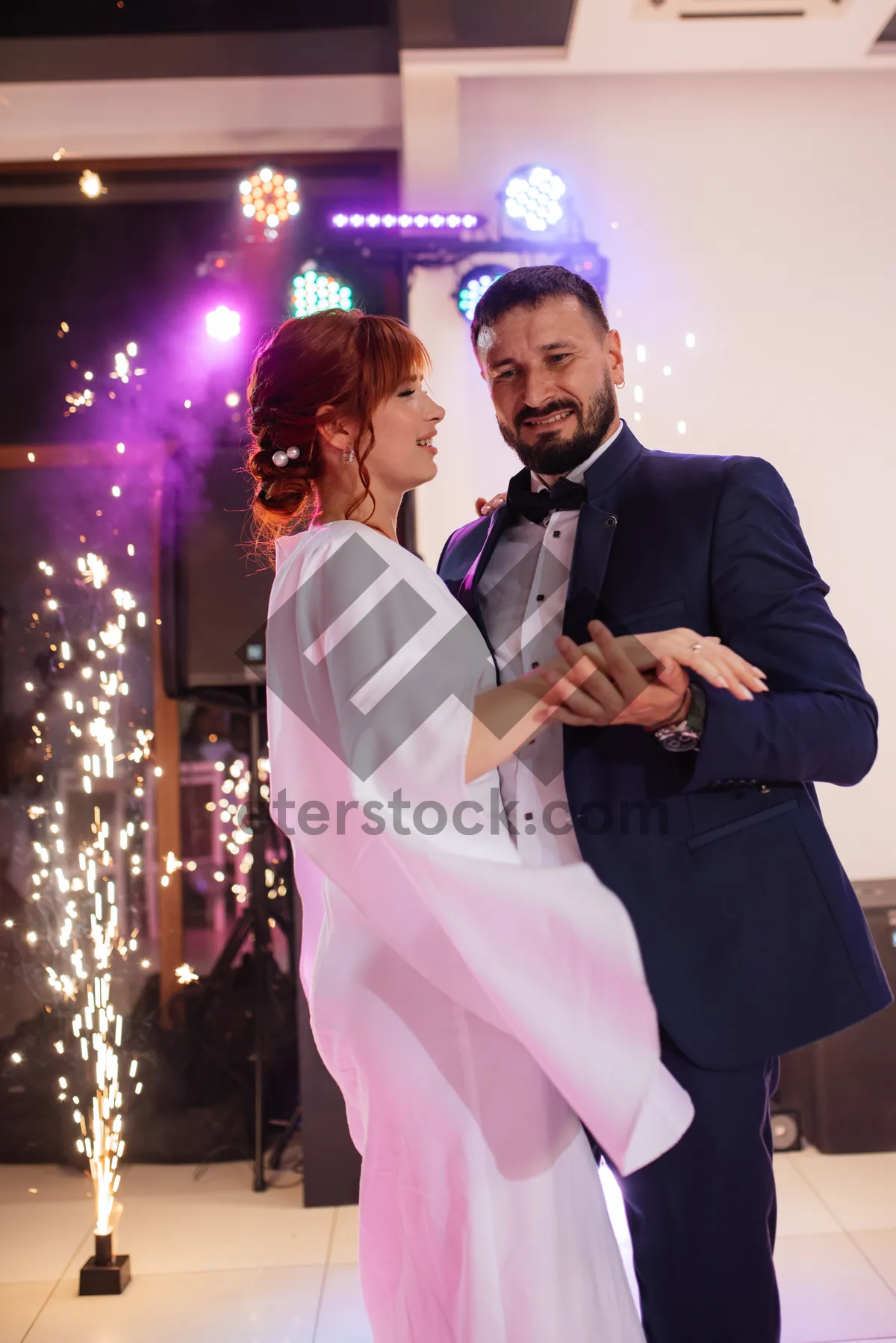 Picture of Smiling businessman in black suit giving speech