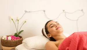 Happy brunette lady relaxing on bed at home