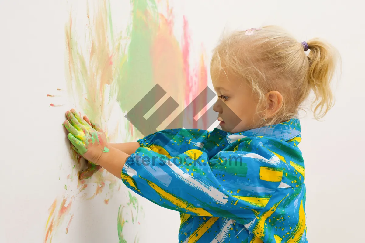 Picture of Happy Blond Child with Pinwheel Smiling Happily